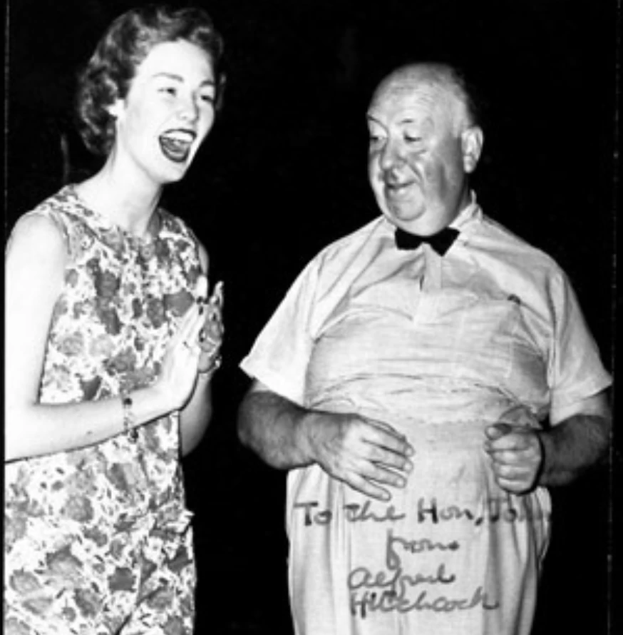 a woman laughing with a man