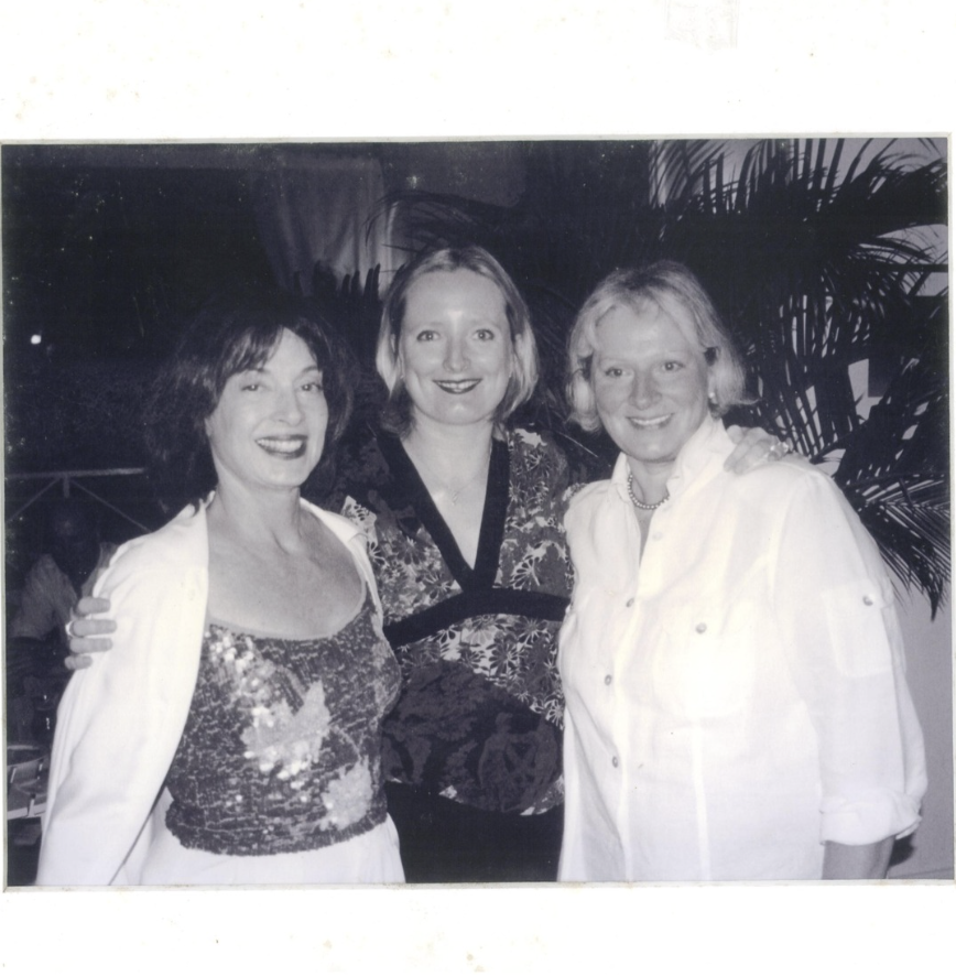 a group of women posing for a photo