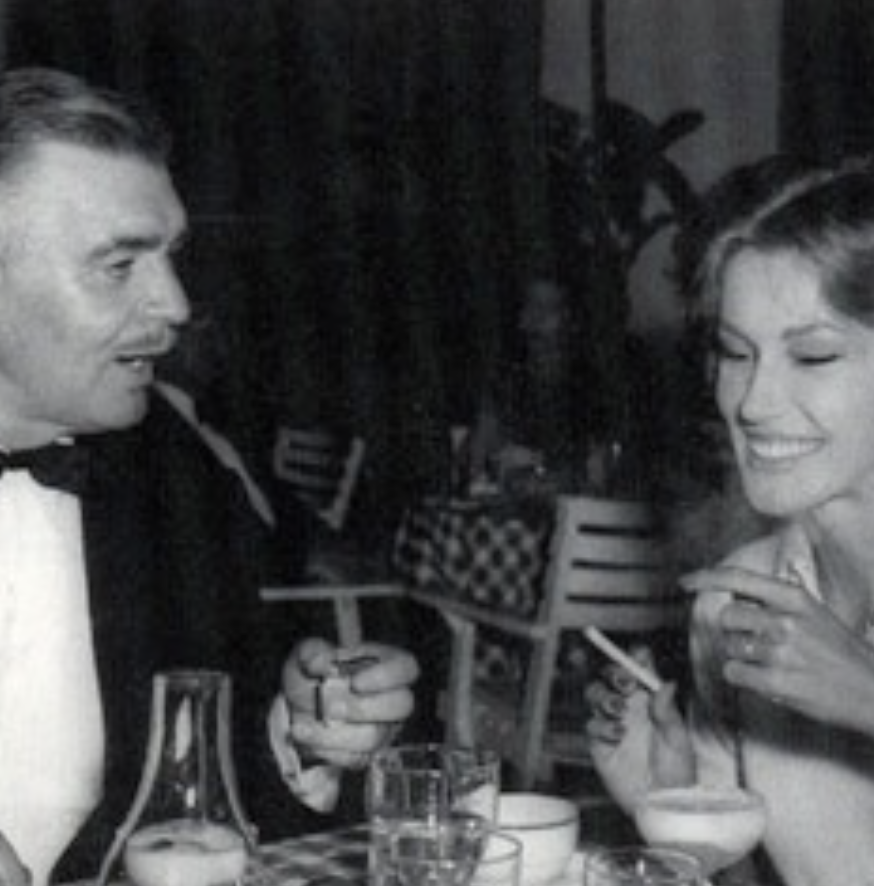 a man and woman sitting at a table