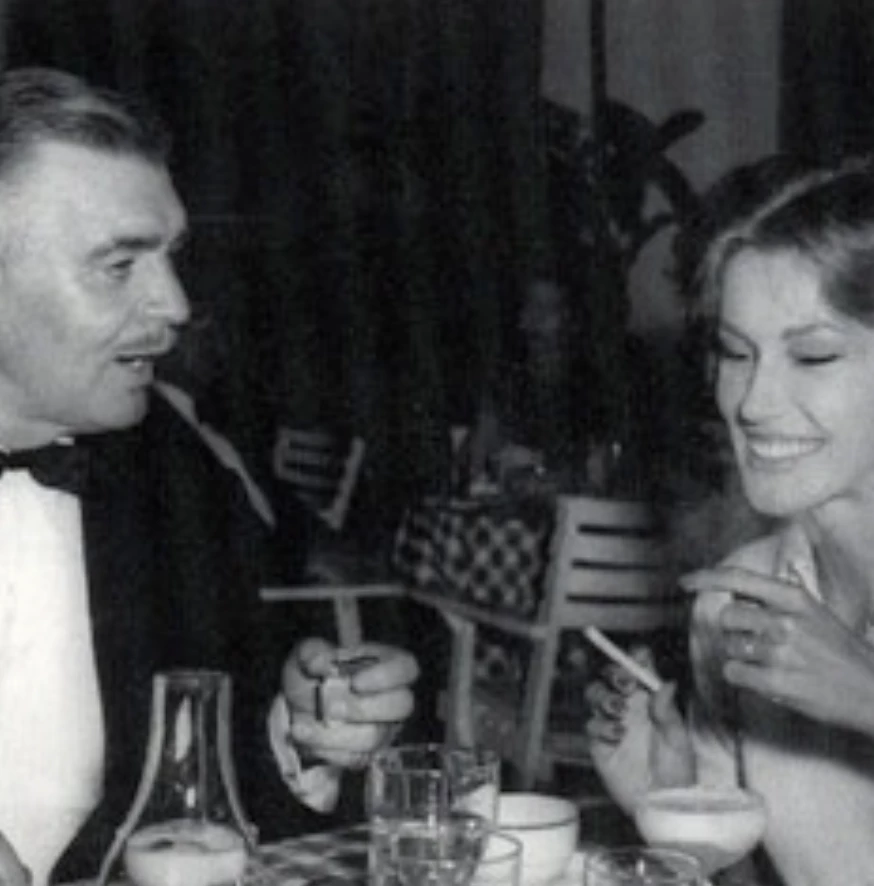 a man and woman sitting at a table