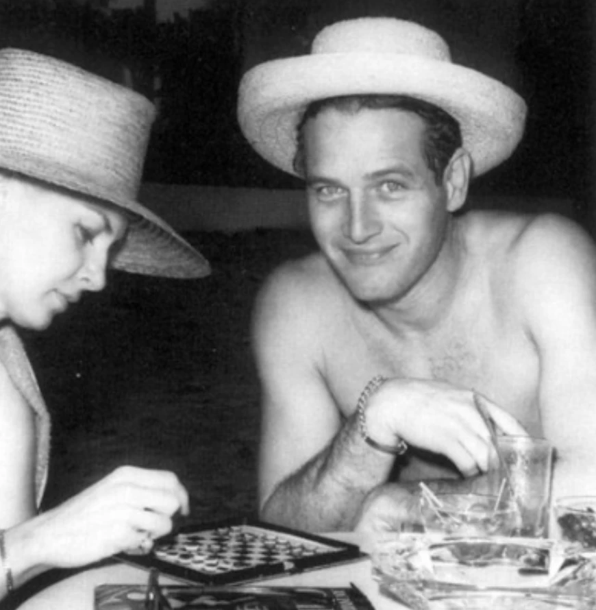 a man and woman playing checkers