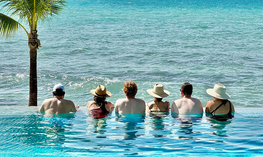 a group of people sitting in a pool