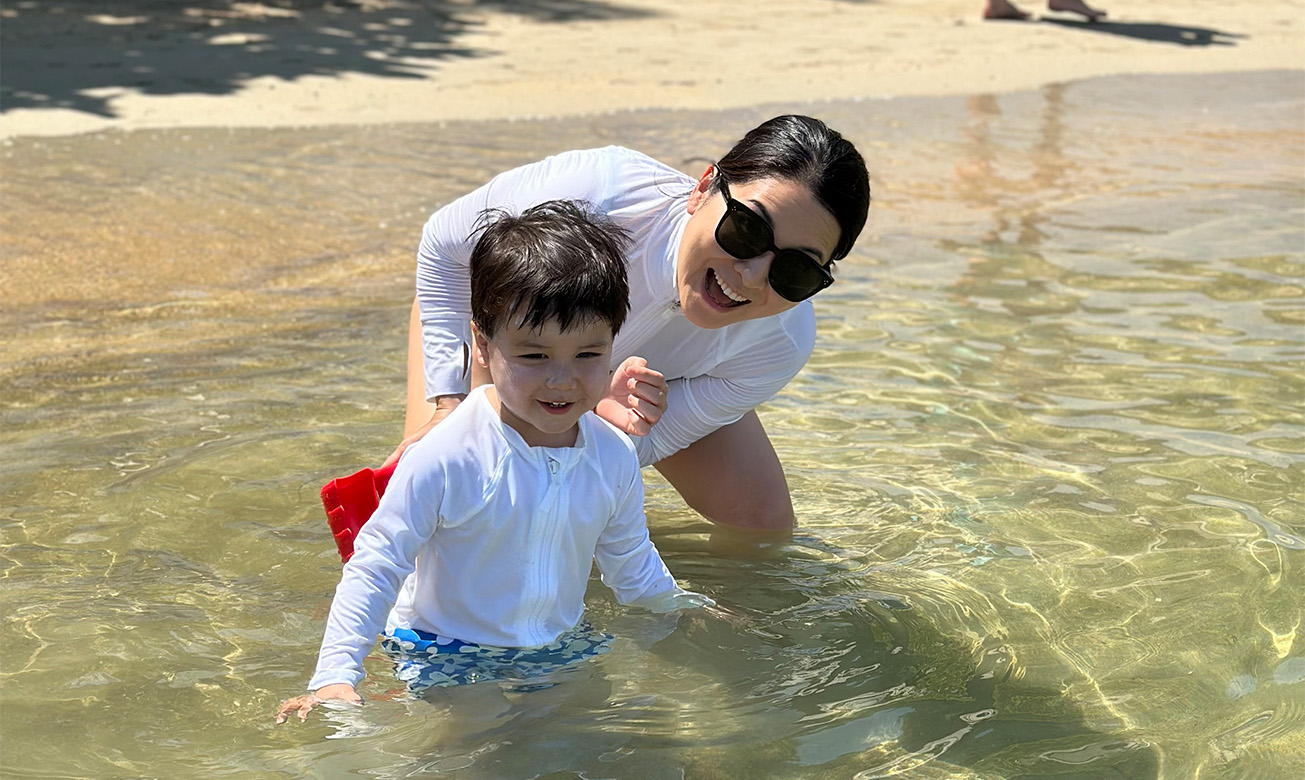 a woman and child in water