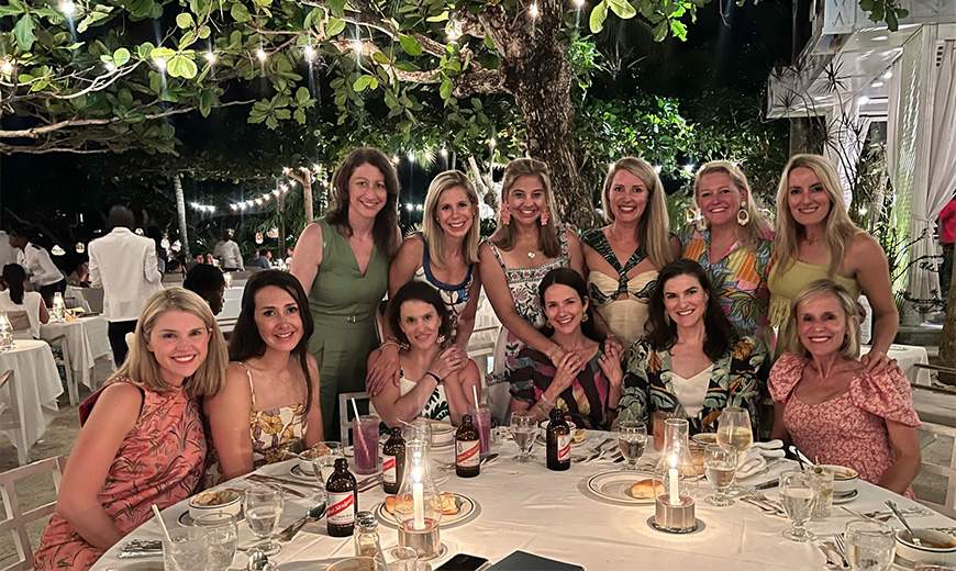 a group of women sitting at a table