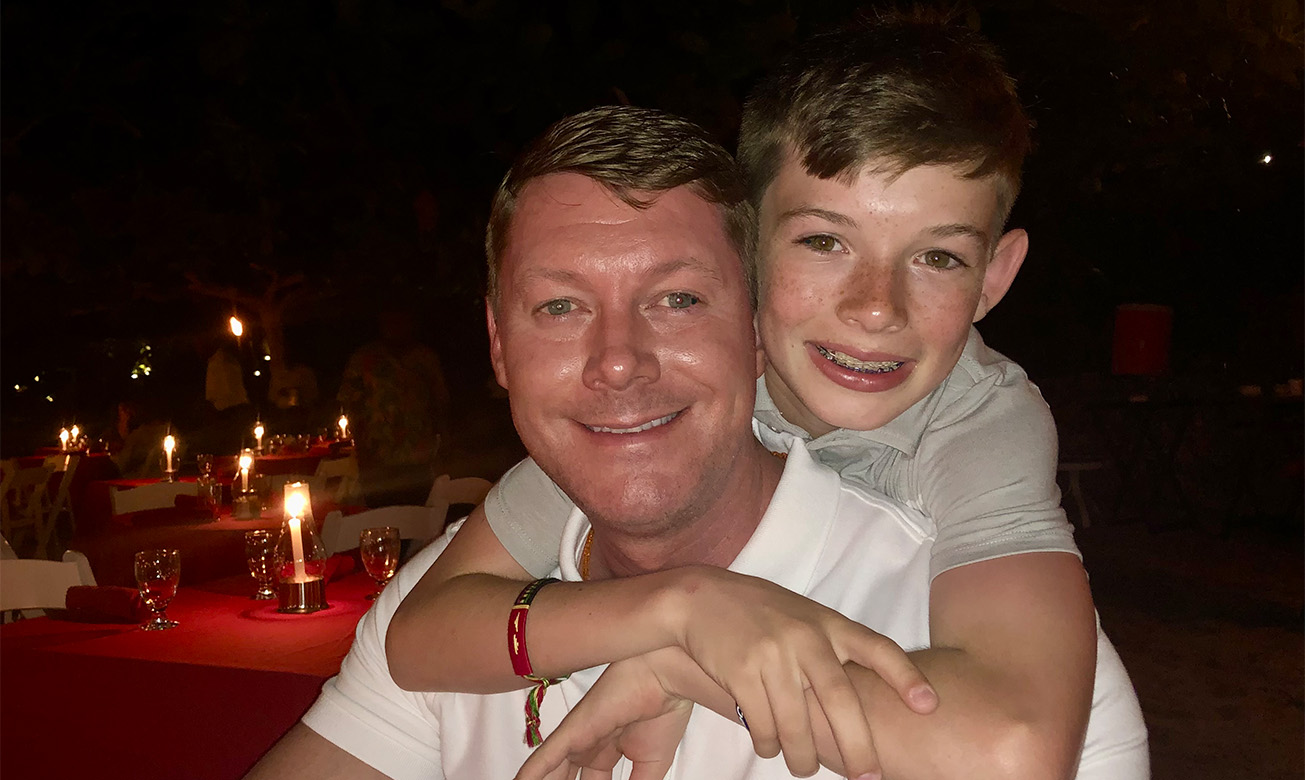 a man and boy posing for a picture