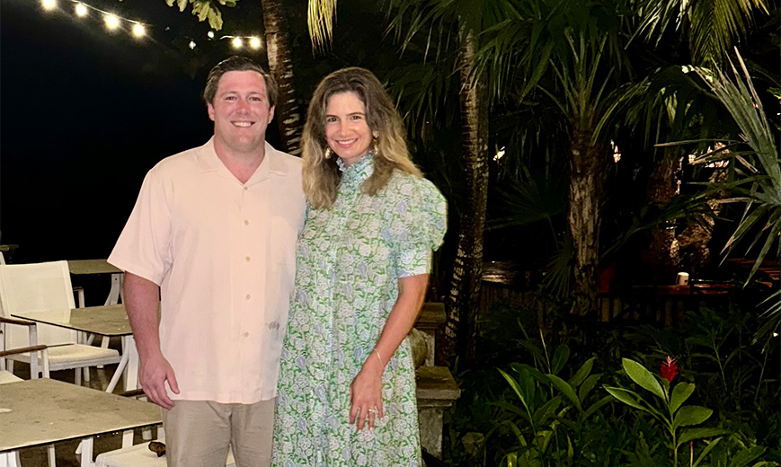 a man and woman standing together smiling