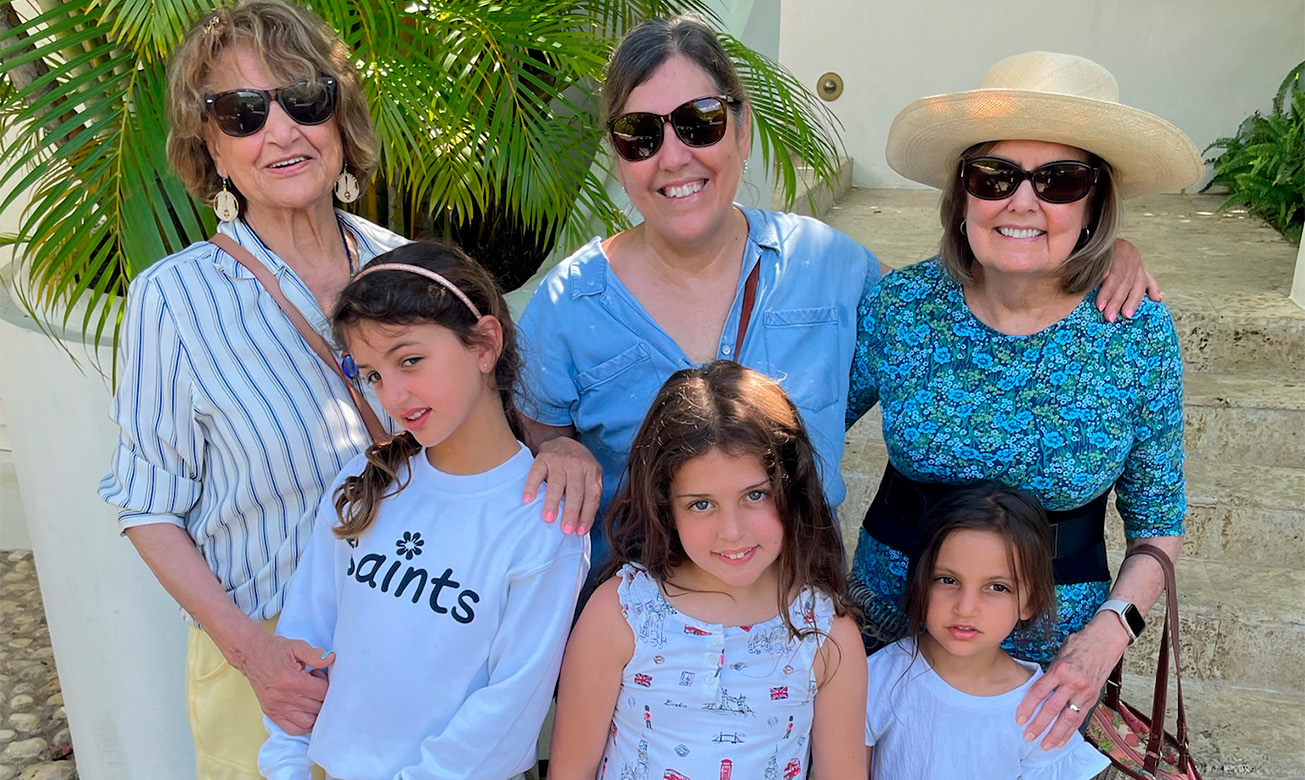a group of women and girls posing for a photo