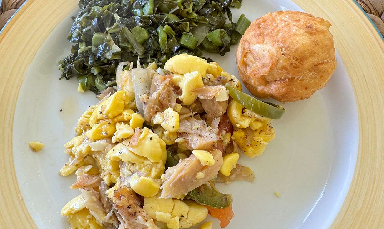 a plate of food with a roll