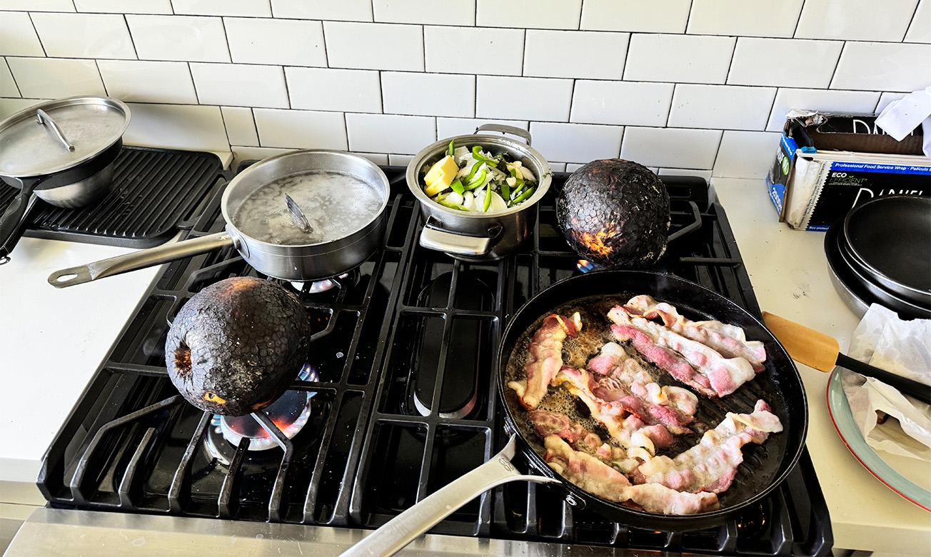 pans and food cooking on a stove