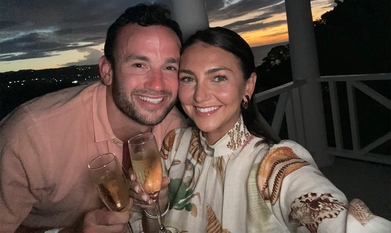 a man and woman holding champagne glasses