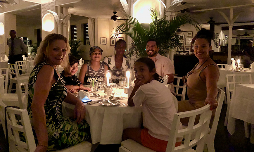 a group of people sitting around a table