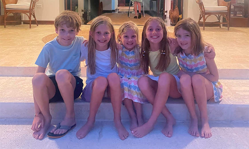a group of children sitting on a step
