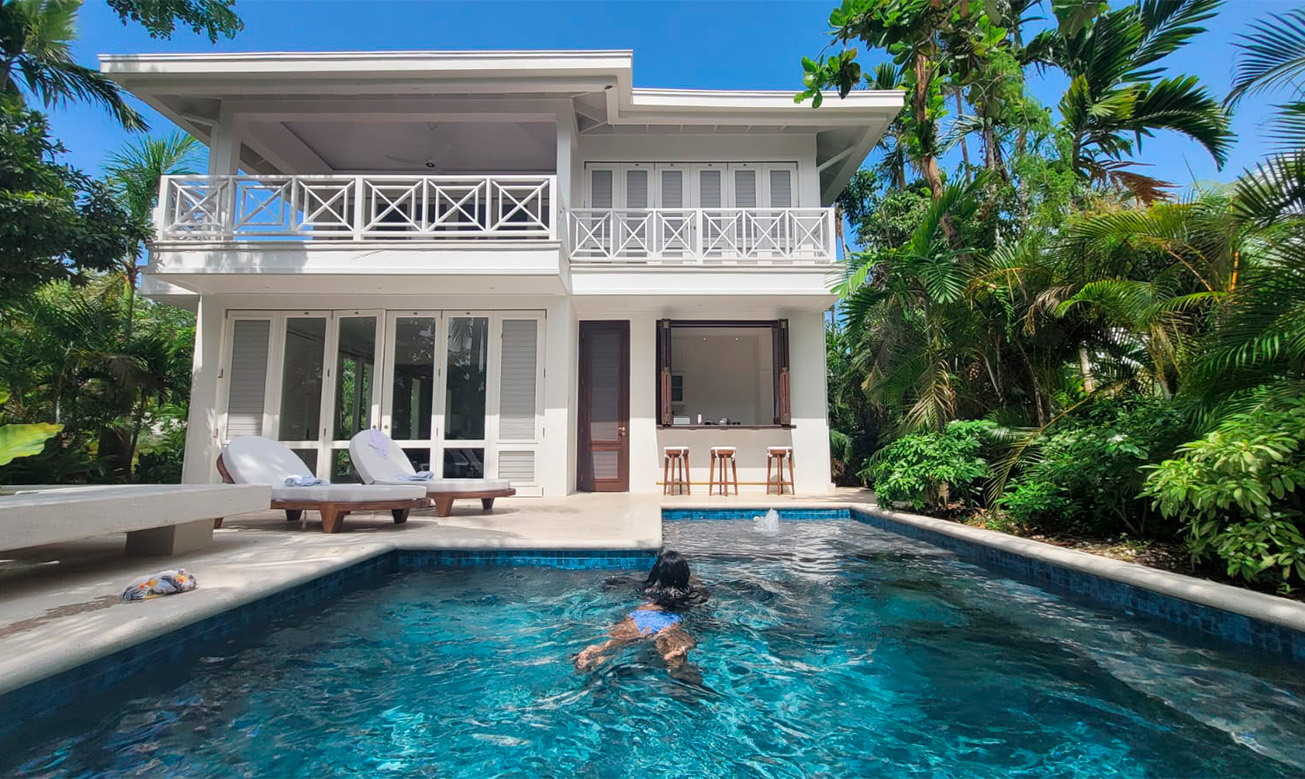 a woman swimming in a pool