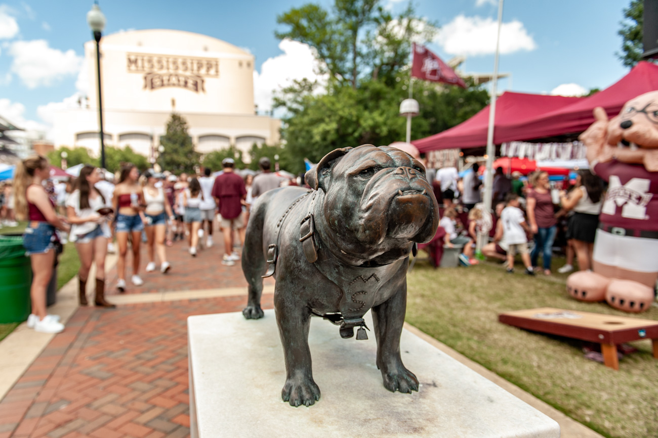 a statue of a dog on a pedestal