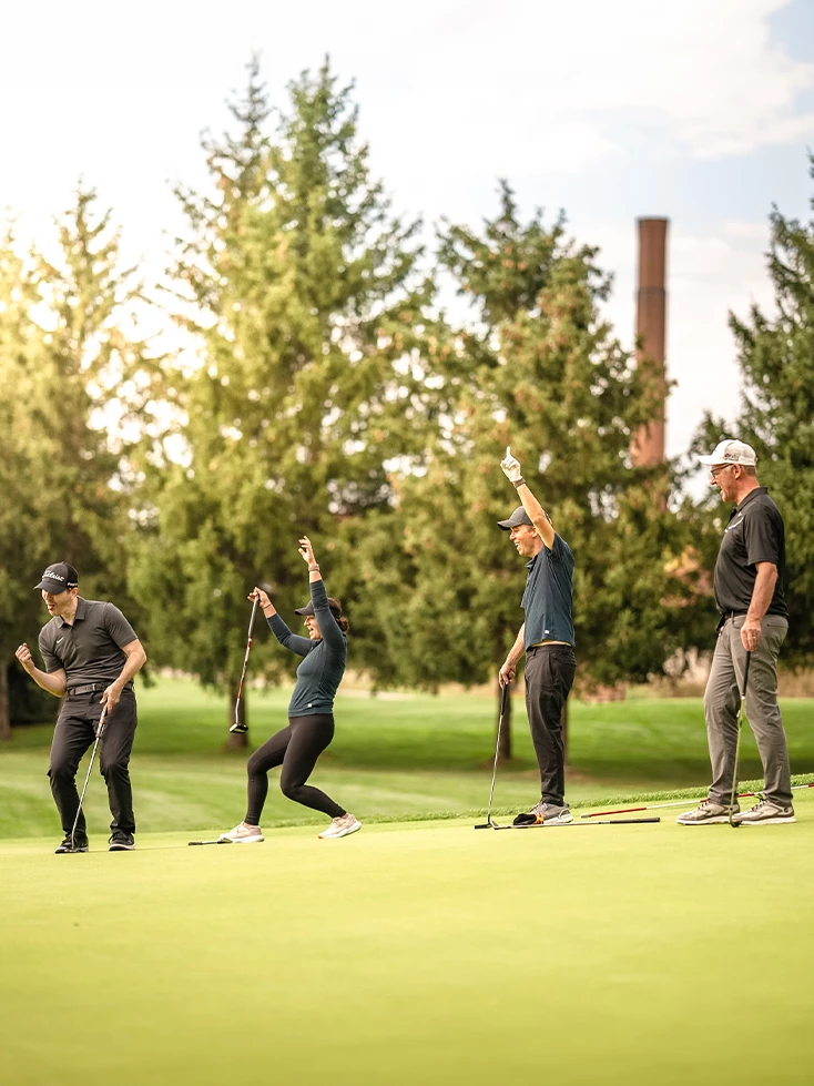 a group of people on a golf course