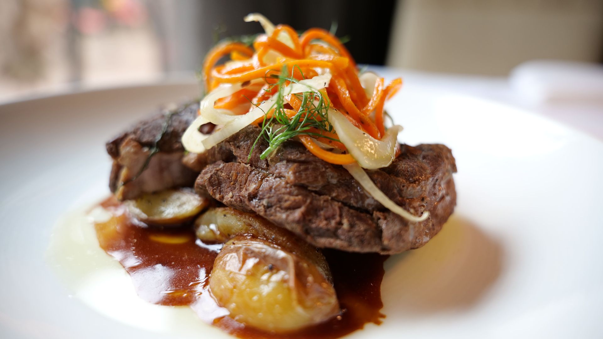 a plate of food with sauce and vegetables