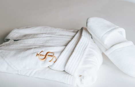 a white robe with a dollar symbol on it