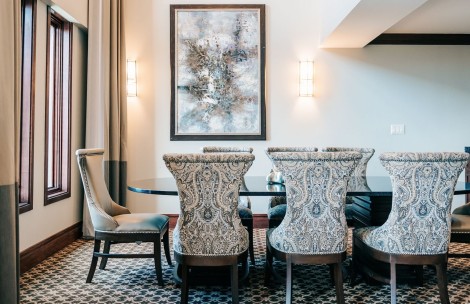 a dining room with chairs and a table