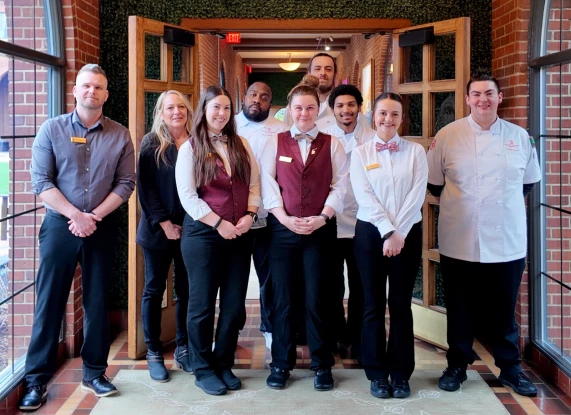 a group of people standing in front of a door
