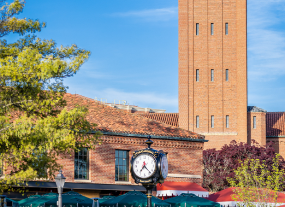 a clock tower in front of a building