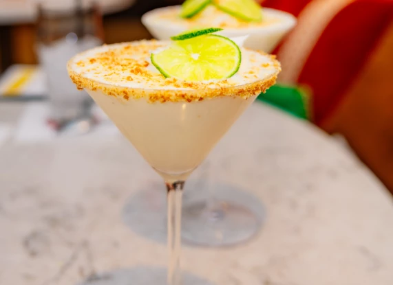 two glasses with food on top