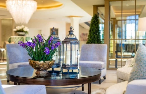 a vase of purple flowers on a table