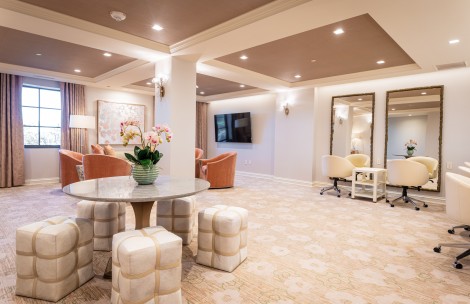 a room with a round table and chairs