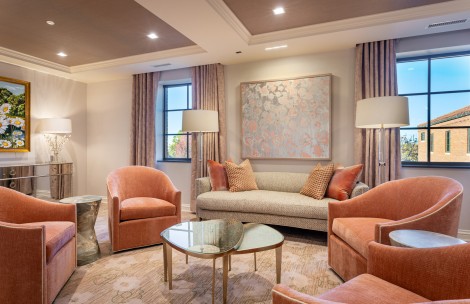 a living room with couches and chairs