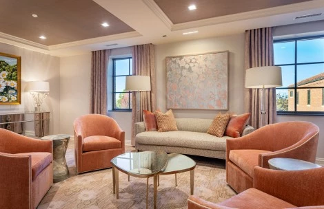 a living room with couches and chairs