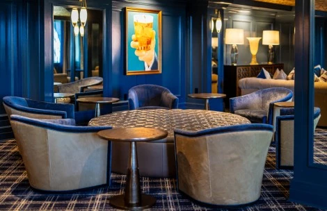 a room with a round table and chairs