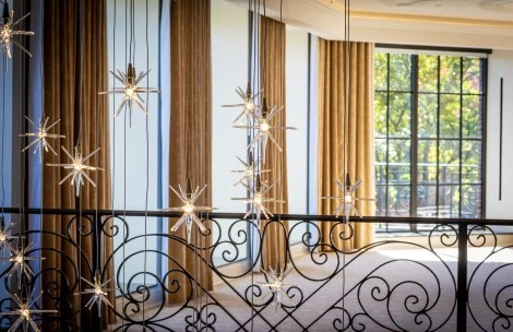 a star shaped lights from a railing