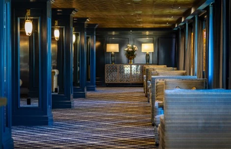 a room with chairs and a mirror