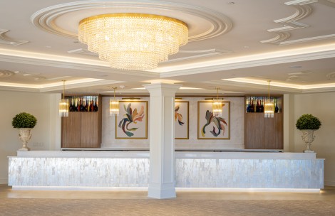 a reception desk with a chandelier