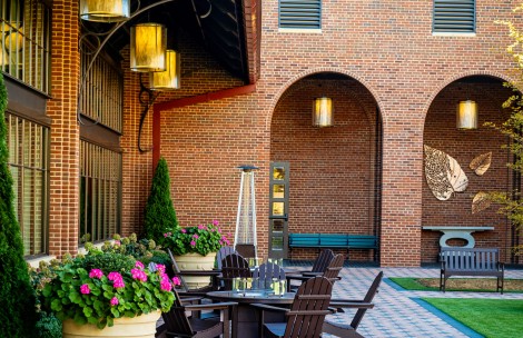 a patio with chairs and a table