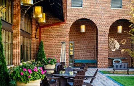 a patio with chairs and a table