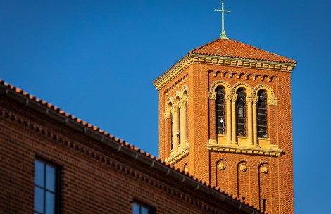 a brick building with a cross on top