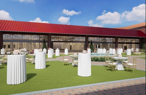a building with tables and chairs outside