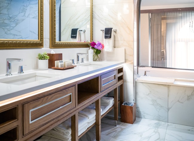 a bathroom with marble floor and marble walls