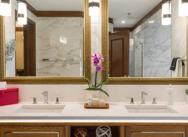 a bathroom with a mirror and sink