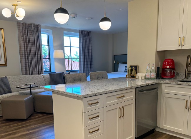 a kitchen with a large island and a couch