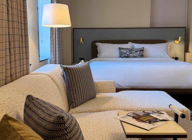 a couches and a lamp in a hotel room
