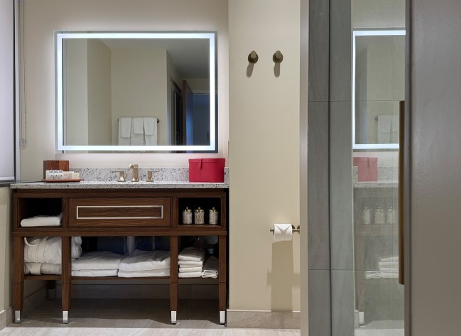 a bathroom with a mirror and a sink