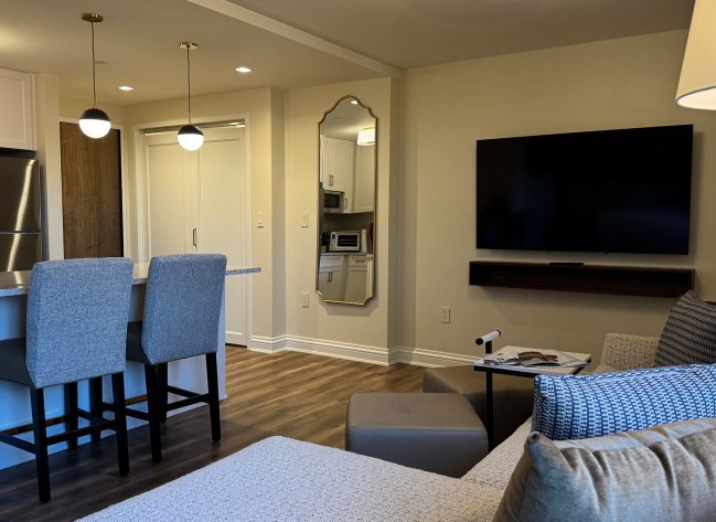 a living room with a television and a table
