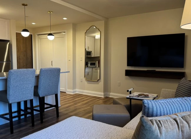 a living room with a television and a table