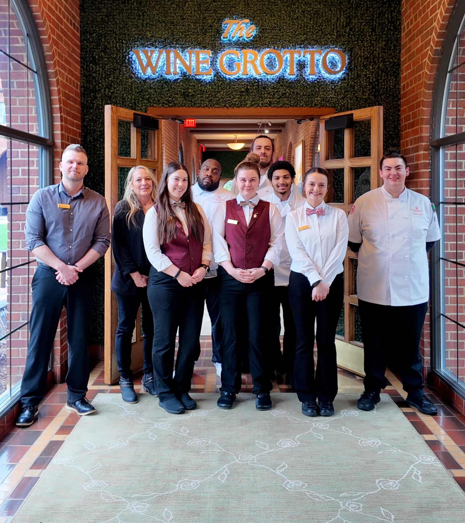 a group of people standing in front of a door
