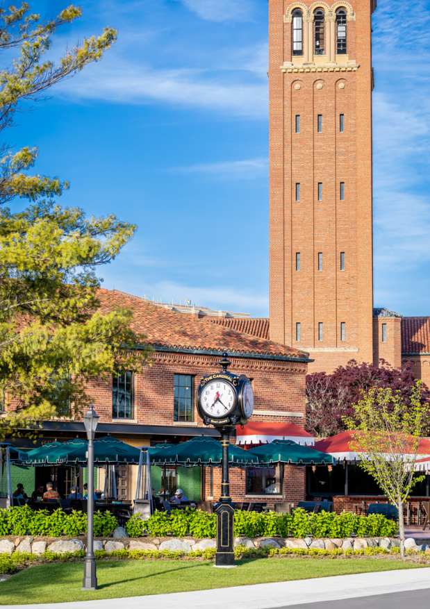 a clock tower in front of a building
