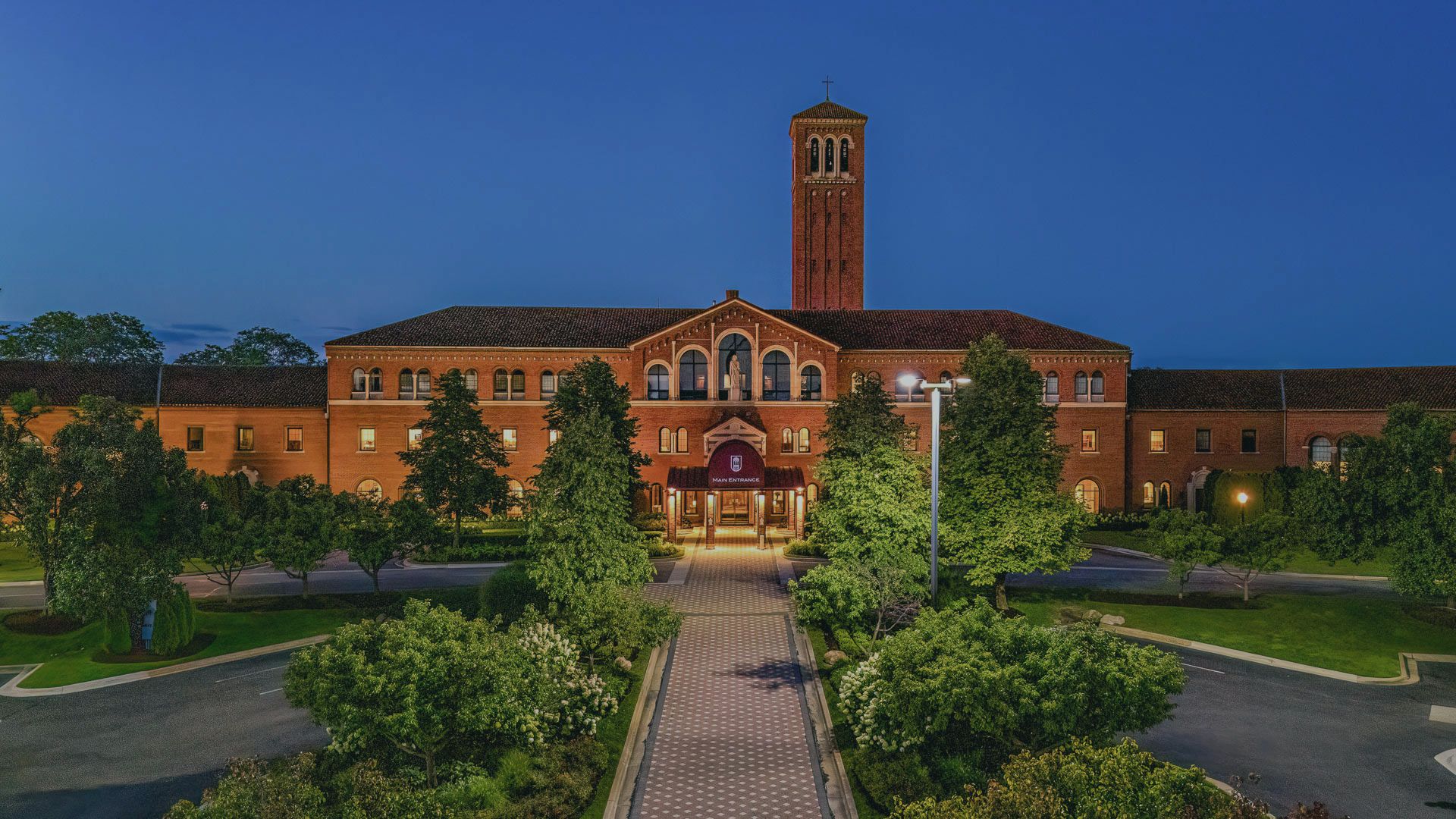 a building with a tower and trees