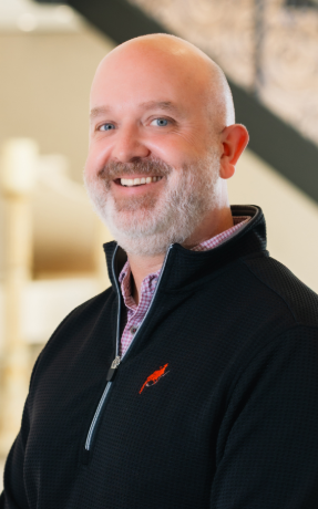 a man smiling for the camera