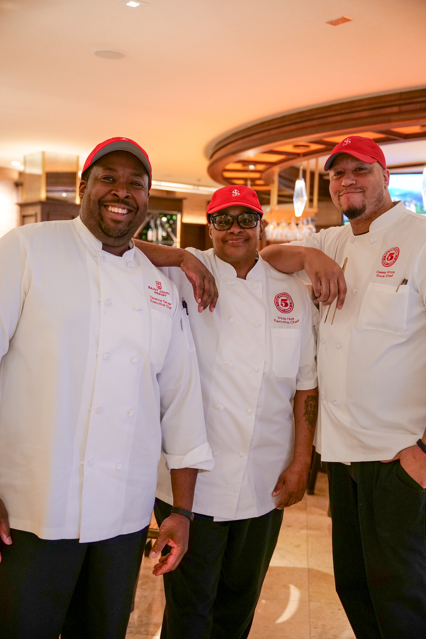 a group of men wearing white uniforms