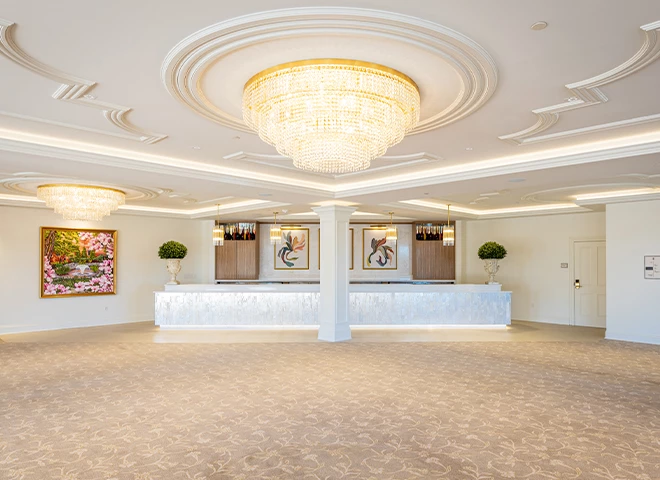 a large room with a chandelier and a table